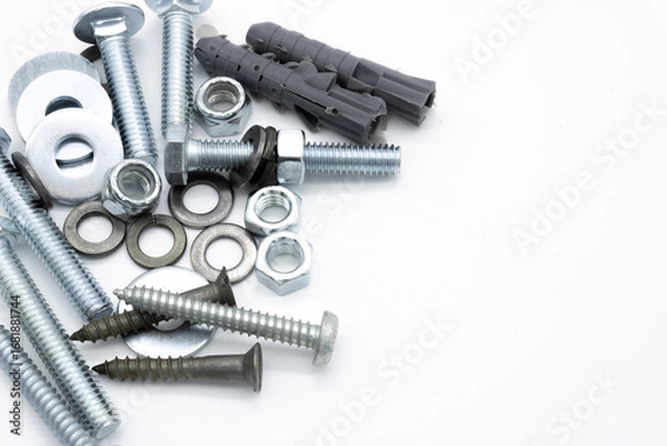 Fototapeta Set of screws of different types, allen, grade 5, hexagonal millimeter, eye bolts, washers, dowel, car screw, clamps on white background copy space	