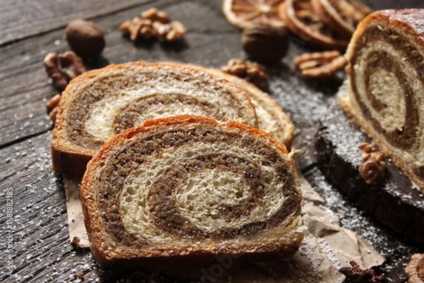 Obraz Walnut roll on a wooden background. Croatian orehnjaca
