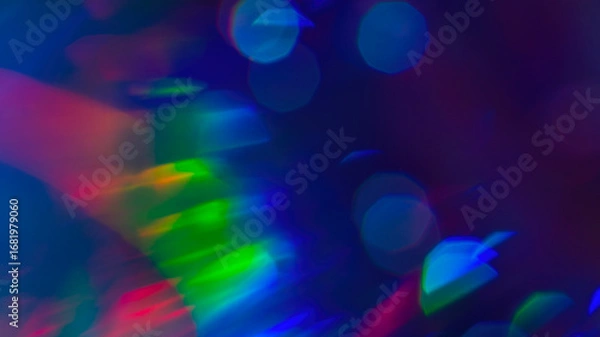 Fototapeta Abstract rainbow bokeh lights, colorful holographic blur on dark background, vibrant glowing texture