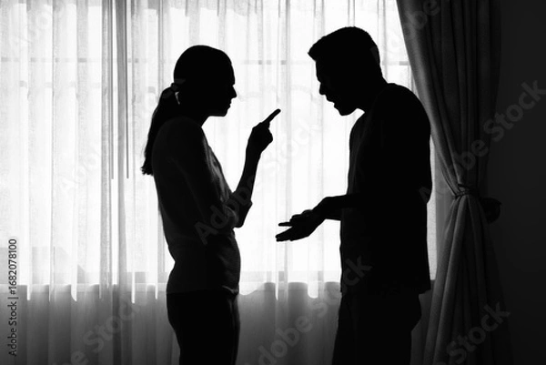 Fototapeta silhouette of couple arguing fighting at home, family issues, marriage relationship problems	