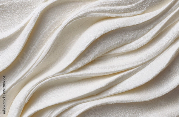 Fototapeta Creamy, textured swirls of white substance