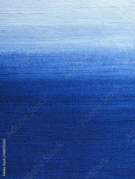 Fototapeta Textured blue and white color wash exhibits a gradient effect across the entire canvas