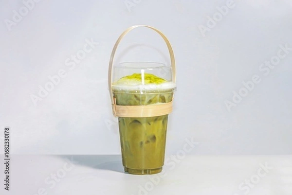 Obraz Ice matcha green tea serving on white background, Isolation style.