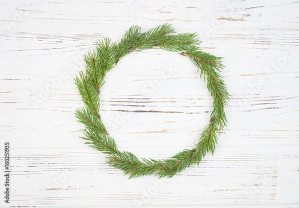 Obraz Christmas Round Frame with fir tree, on rustic wood.