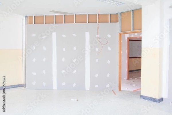 Obraz gypsum board wall interior decoration of home at construction site with copy space add text
