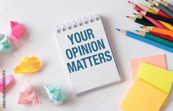 Fototapeta Your Opinion Matters symbol. Concept words Your opinion matters on beautiful white notebook. White background. Business your opinion matters concept.