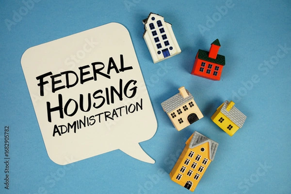 Obraz FHA Federal Housing Administration text with house models on blue background