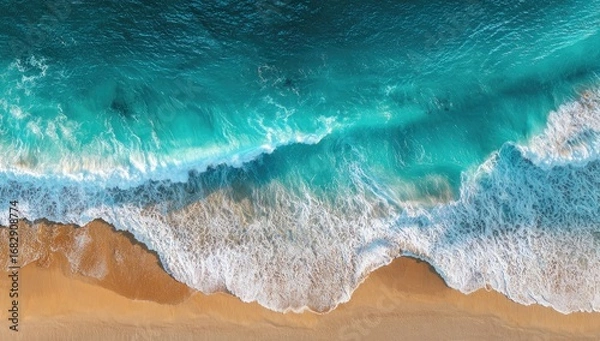 Fototapeta High-angle view of a turquoise beach, waves crashing on shore