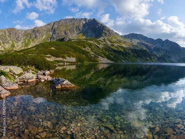 Fototapeta Mountain Lake with Rocky Shoreline