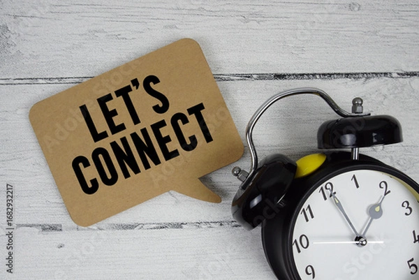 Obraz Let's connect text with alarm clock on wooden background