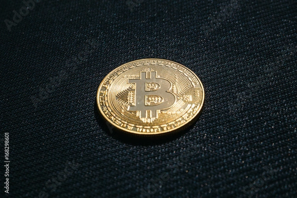 Fototapeta Golden coin of Bitcoin on black