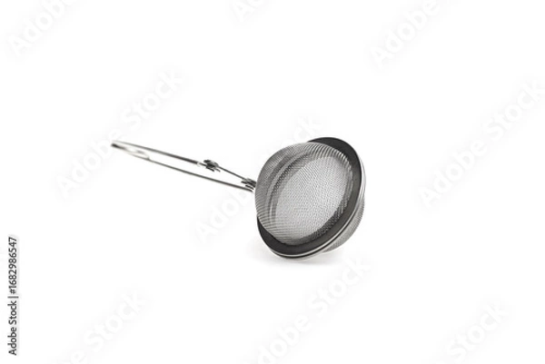 Fototapeta Stainless steel tea infuser with handle, designed for brewing loose leaf tea, featuring a fine mesh strainer and ergonomic grip for easy use and optimal flavor extraction