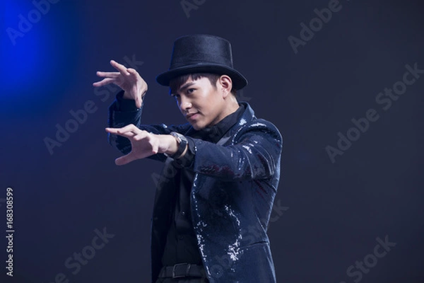 Obraz Young magician performing magic trick