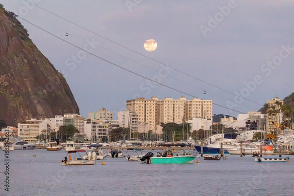 Fototapeta view of the moonrise in the urca neighborhood in rio de janeiro.