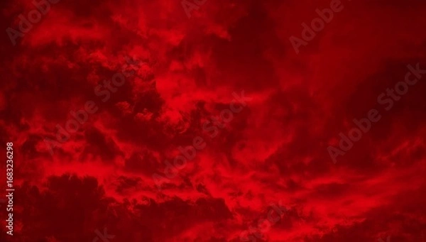 Fototapeta Dramatic red sky with ominous clouds creating an atmospheric and visually striking scene