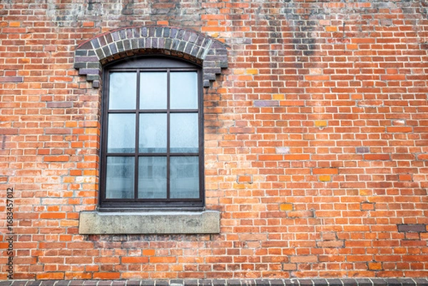 Obraz Orange brick wall with classic rectangle style window for background