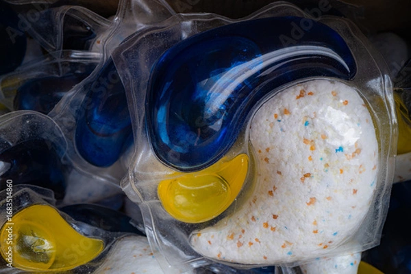 Fototapeta Close-up of a laundry detergent pod in a washing machine drawer.