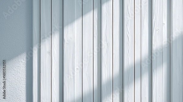 Fototapeta White wooden slat wall with vertical lines and natural wood texture, illuminated by soft sunlight casting shadows, creating modern and minimalist atmosphere