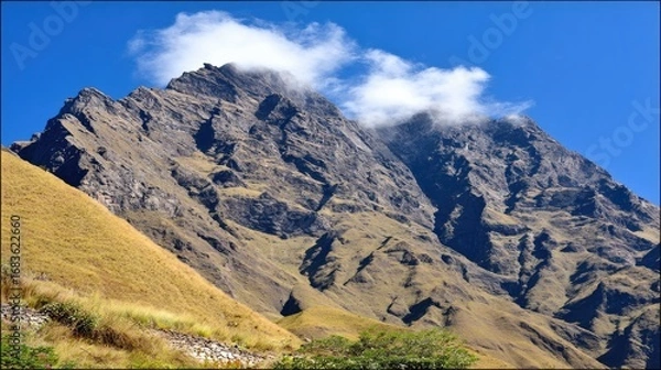 Fototapeta Mountain range with hazy clouds