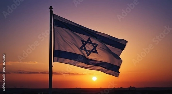 Fototapeta The flag of Israel proudly waving against a vibrant sunset. The flag displays a Star of David centered between two blue stripes on a white background, symbols of Jewish faith and heritage