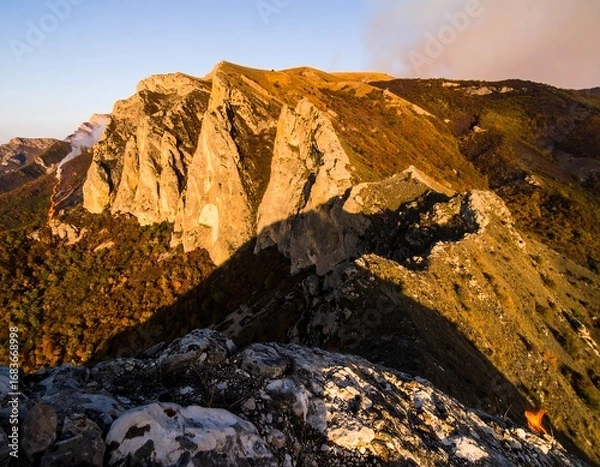 Fototapeta Mountain ridge at sunrise, autumn colors