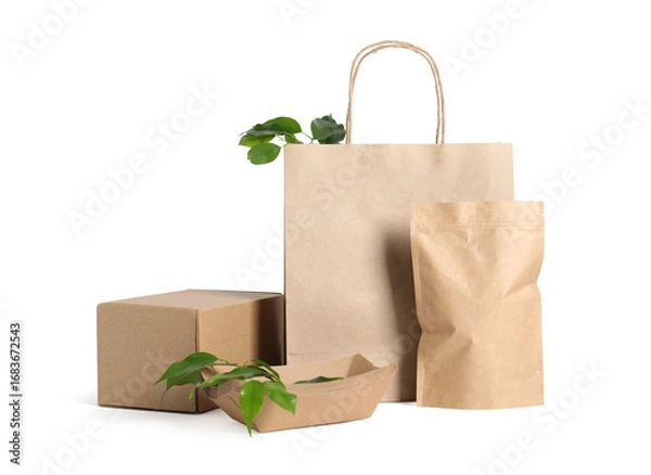 Fototapeta Different eco friendly packaging and leaves isolated on white