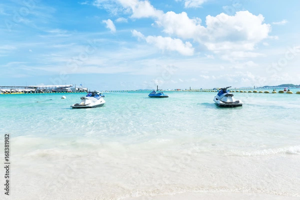 Obraz Blue sea and a jet ski floating on the sea, 
