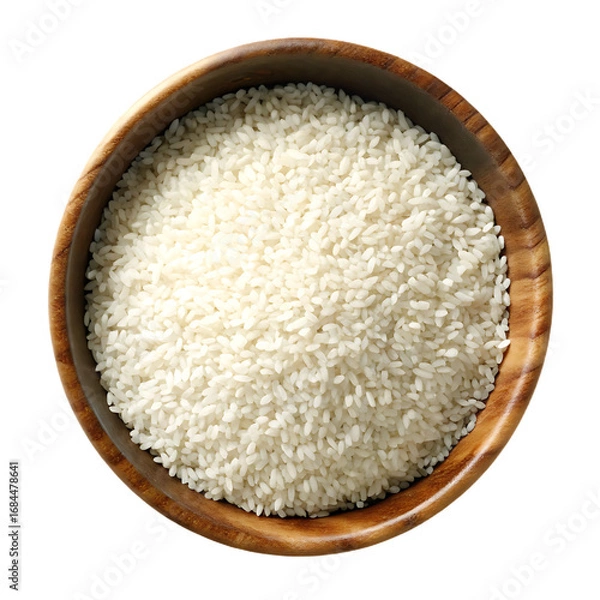 Fototapeta White rice in wooden bowl top view isolated on a transparent background uncooked rice
