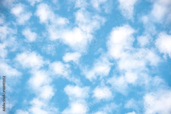 Fototapeta Beautiful fluffy cloud, bright blue sky background. Relaxing romantic cloudscape view.