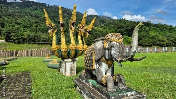 Obraz Statues of various animals in the grassland