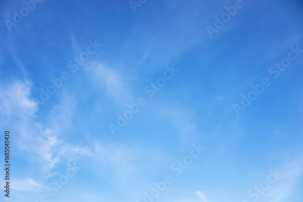 Obraz Blue sky background and white clouds soft focus, and copy space horizontal shape.