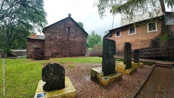 Obraz  Exterior view of the historic Chapel of St. Catherine, showcasing medieval architecture on a cloudy, rainy day