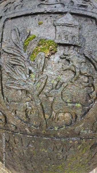 Obraz  Historic gravestone with intricate carvings and engravings displayed in the open area of the Chapel of St. Catherine, Old Goa