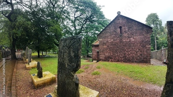 Obraz  Exterior view of the historic Chapel of St. Catherine, showcasing medieval architecture on a cloudy, rainy day