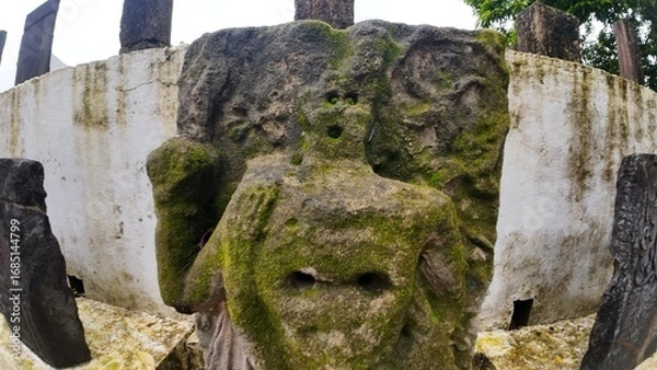 Obraz  Historic gravestone with intricate carvings and engravings displayed in the open area of the Chapel of St. Catherine, Old Goa