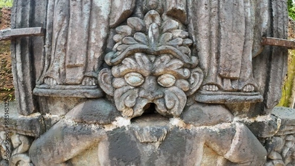 Obraz  Historic gravestone with intricate carvings and engravings displayed in the open area of the Chapel of St. Catherine, Old Goa