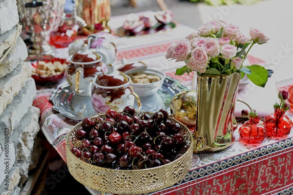 Obraz Juicy cherries on a golden tray, a symbol of abundance. Clean and healthy vegetarian food.