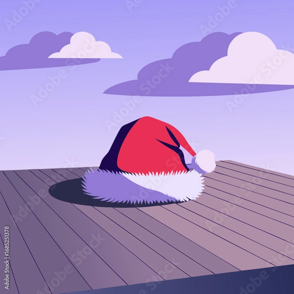 Obraz Santa hat on table. Red Santa hat on wooden surface with purple sky and clouds  