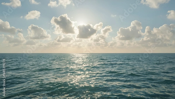 Fototapeta Open Ocean View with Sunlight Reflecting on Water Under Cloudy Skies