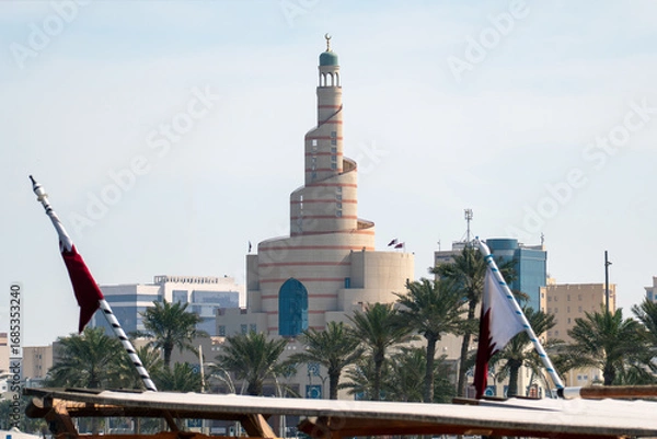 Fototapeta Doha, Qatar - Islamic Cultural Center in Doha with blue sky. Also known as Al-Fanar, it is one of the most beautiful minarets in Souq Waqif and a famous architectural landmark