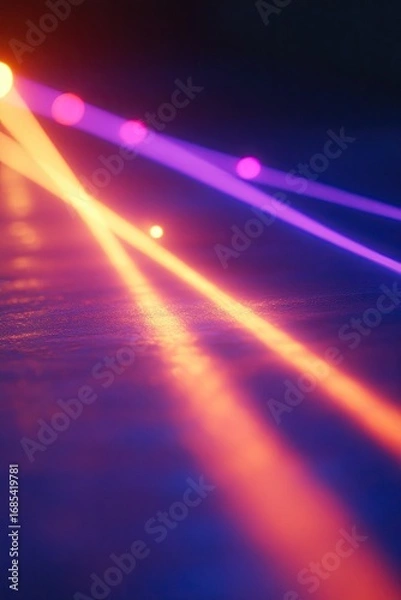 Obraz Vibrant, dynamic light beams crisscrossing a dark surface