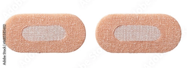 Fototapeta Two light beige, oval-shaped medical adhesive bandages with a centered,  translucent fabric patch
