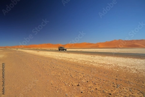 Fototapeta Traveling through desert roads is a great adventure and a great pleasure.