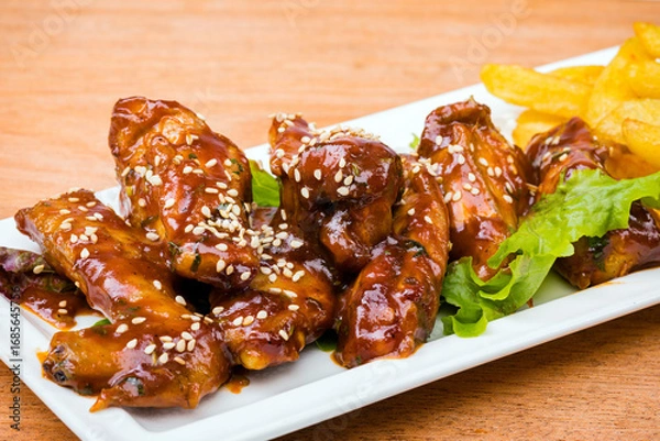 Obraz fried chicken wings with sauce