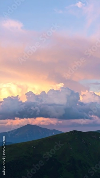 Obraz Blurry mountain range at sunset, soft clouds