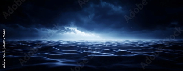 Fototapeta Serene ocean scene with dark, moody clouds above and gentle waves reflecting soft light. atmosphere evokes sense of calm and introspection