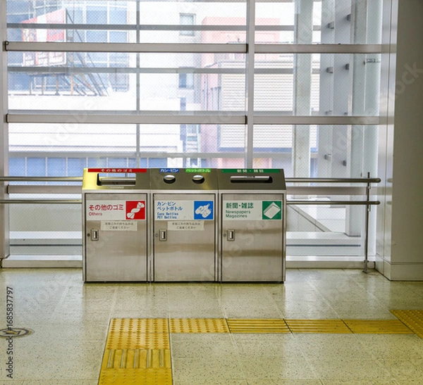 Fototapeta recycle  trash can (garbage bin) in japan train station. Japanese character tell about type of gabage to drop in such as paper, newsletter, bottle etc.