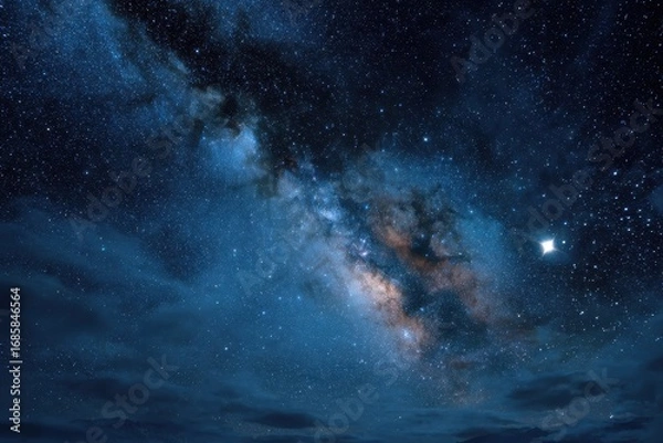 Fototapeta Breathtaking view of the Milky Way galaxy stretching across the night sky over a serene landscape with twinkling stars and mystic clouds