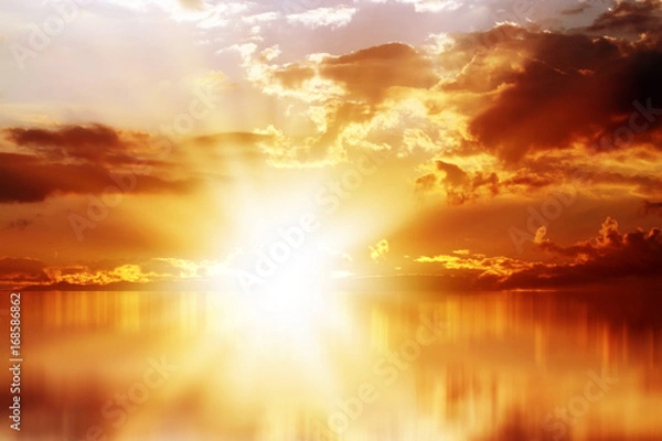 Fototapeta Gold Sunset over the Sea, Rich in Dark Clouds, Rays of Light