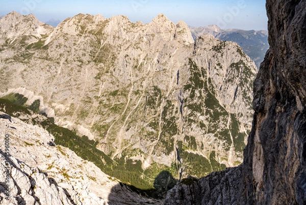 Fototapeta View From The Alpspitze Via Ferrata Into The Höllental Valley: Scenic Bavarian Alps Landscape With Rugged Rock Faces And Mountain Peaks